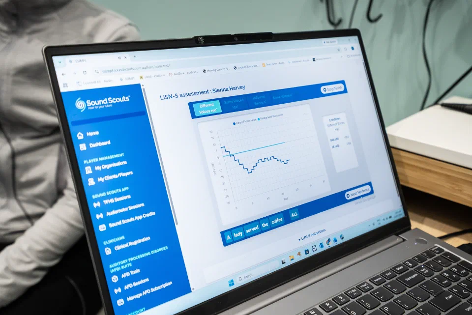 An audiologist reviewing Sound Scouts results in SSIMPL on a tablet